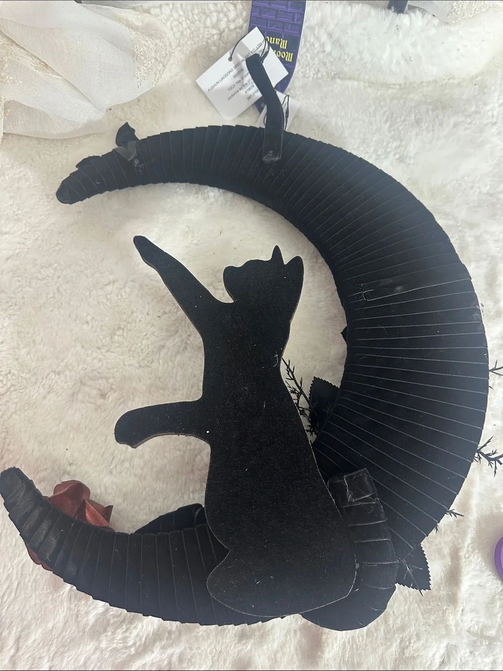 Moonlight Manor crescent moon wreath features a black cat silhouette